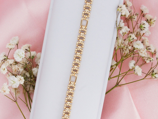 Błyszcząca złota bransoletka z ruchomych elementów na każdą okazję