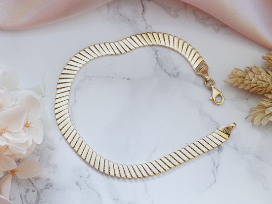 Bransoletka złota taśma z ruchomych elementów