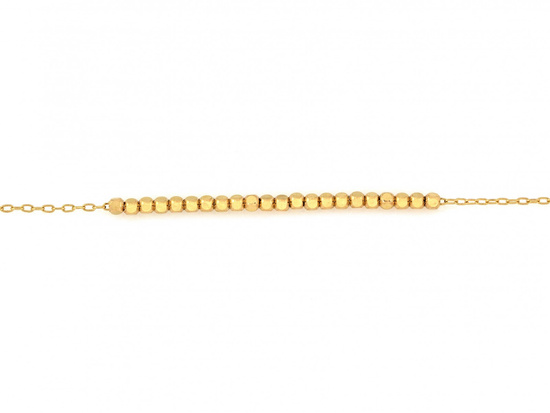 Delikatna złota bransoletka z małymi kostkami