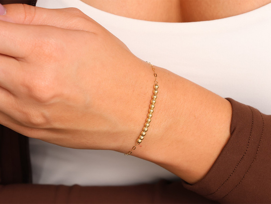 Subtelna  złota bransoletka z kuleczkami