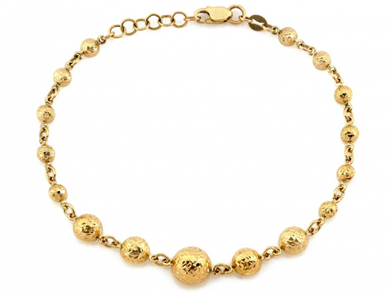 Złota bransoletka z kulkami błyszcząca efektowna