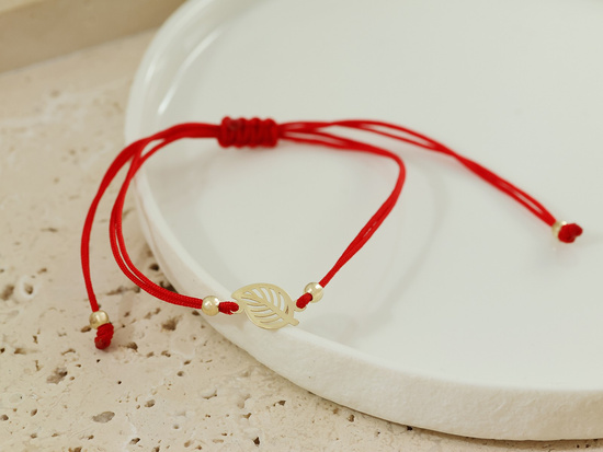 Bransoletka złota czerwona sznurkowa z ażurowym liściem