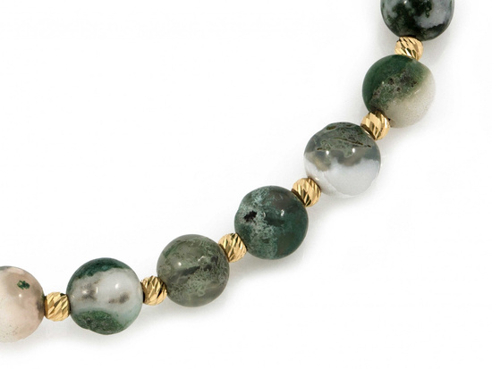 Bransoletka złote  kulki i zielone kamienie na czarnym sznurku