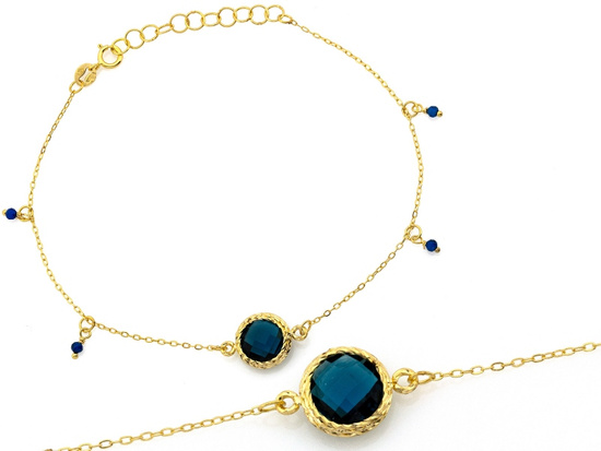 Złota bransoletka z zawieszkami z topazem syntetycznym