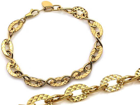 Bransoletka złota duże elementy motyw nieskończoności