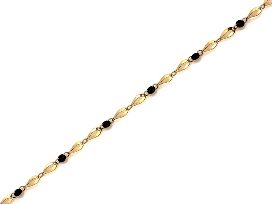 Złota bransoletka owalne ogniwa czarne kamienie