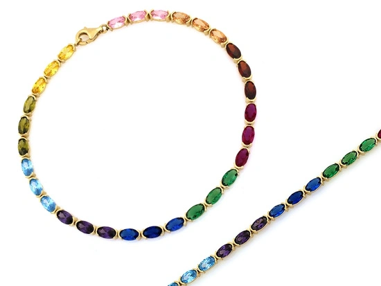 Złota bransoletka elementy z kolorowymi cyrkoniami