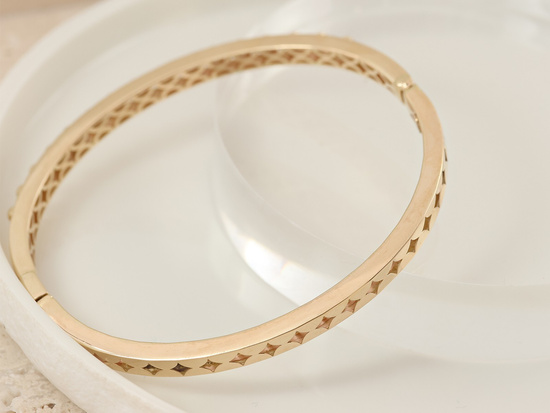 Bransoletka złota sztywna z kulkami nowoczesna