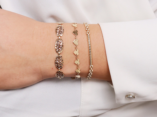 Złota bransoletka sztywne wstawki elementowa