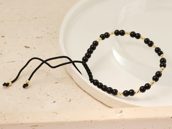 Bransoletka sznurkowa złote i czarne kulki
