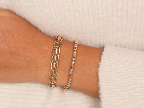 Gruba złota bransoleta damska z przeplatanych ogniw