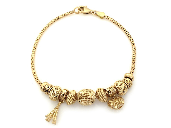 Modna złota bransoletka z zawieszkami wieża Eiffla