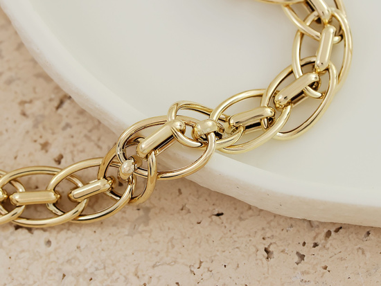 Gruba złota bransoleta damska z przeplatanych ogniw