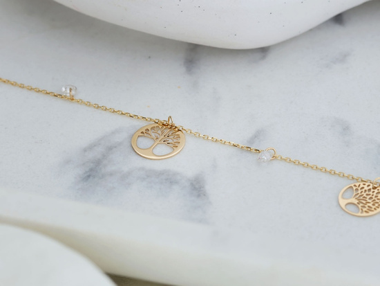 Złota bransoletka z trzema zawieszkami drzewka szczęścia