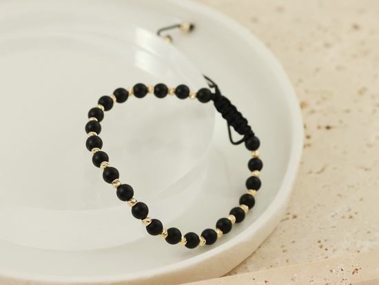 Bransoletka złote kulki i czarne koraliki na sznurku