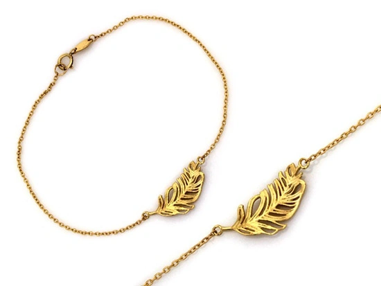 Złota bransoletka piórko