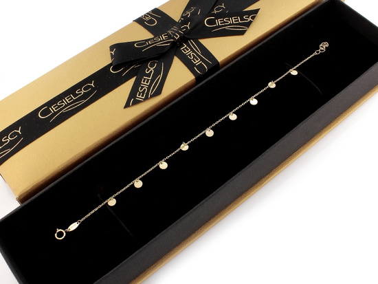 Złota bransoletka z małymi kółeczkami zawieszkami