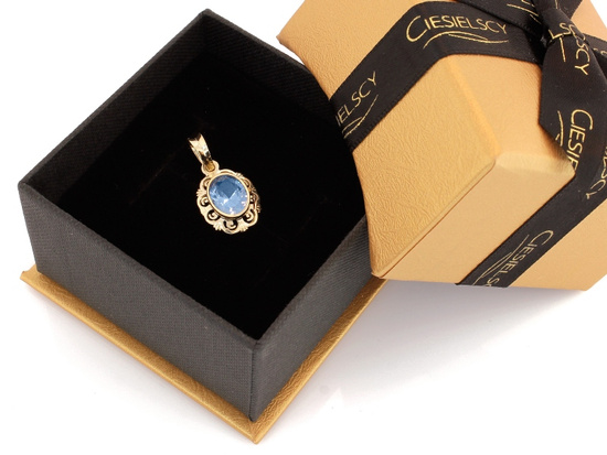 Zawieszka złota owalna z niebieskim topazem