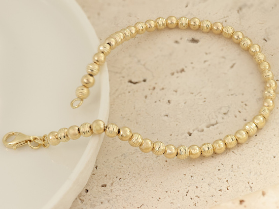 Bransoletka złota z błyszczących kulek