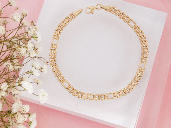 Błyszcząca złota bransoletka z ruchomych elementów na każdą okazję