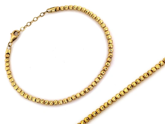 Złota bransoletka z małych frezowanych kulek