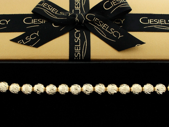 Złota bransoletka z dużych frezowanych kulek