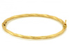 Bransoletka złota sztywna bangle skręcona