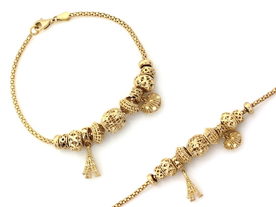 Modna złota bransoletka z zawieszkami wieża Eiffla