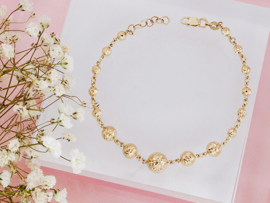 Złota bransoletka z kulkami błyszcząca efektowna
