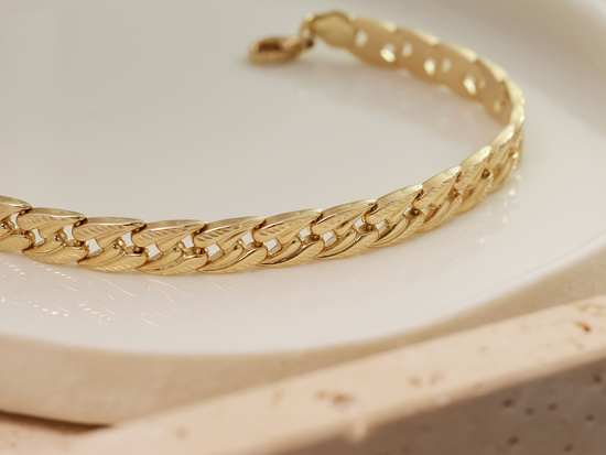 Złota bransoletka szeroka stampato elementowa