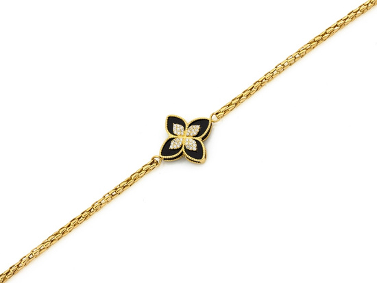 Modna złota bransoletka gruba z modnym czarnym kwiatkiem