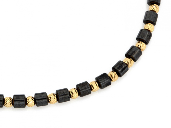 Bransoletka złote kulki i walcowate hematyty na czarnym sznurku