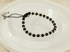 Bransoletka złote kulki i czarne koraliki na sznurku