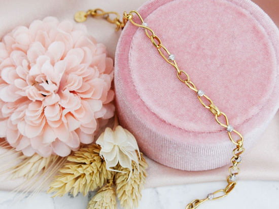 Bransoletka złota przeplatana z kulkami z białego złota