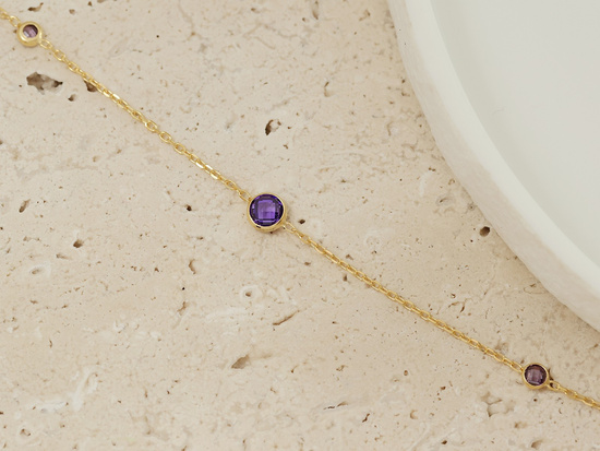 Bransoletka złota z fioletowymi cyrkoniami