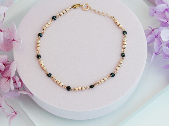 Bransoletka złota z kulkami i czarnymi kamieniami