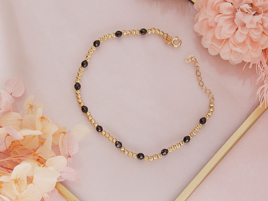 Bransoletka złota z kulkami i onyksami