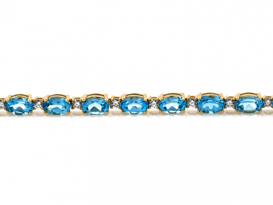 Bransoletka złota z owalnymi niebieskimi kamieniami