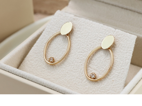 Kolczyki złote owalne z jedną cyrkonią na sztyfcie