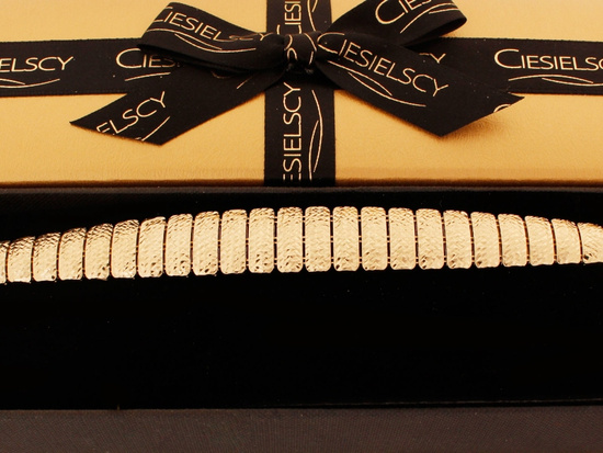 Szeroka złota bransoletka z ruchomych elementów