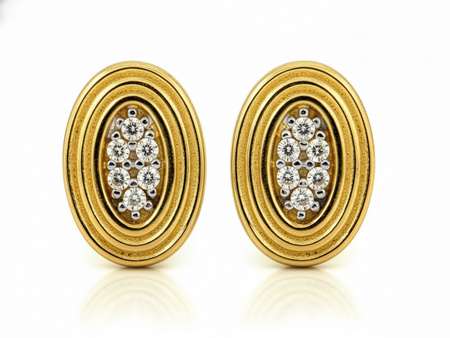 Złote kolczyki owalne na sztyfcie z cyrkoniami