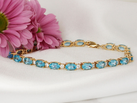 Bransoletka złota z owalnymi niebieskimi kamieniami