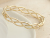 Bransoletka złota sztywna szeroka przeplatana