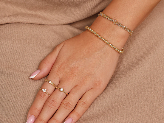 Oryginalna złota bransoletka elementowa z koniczynkami i motylkami