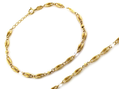 Złota bransoletka z owalnych ogniw i cyrkonii