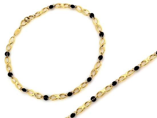 Złota bransoletka z nieskończoności z czarnymi kamieniami