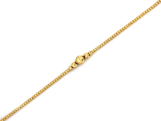 Złota bransoletka z frezowanymi kulkami