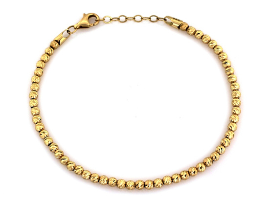 Złota bransoletka z małych frezowanych kulek