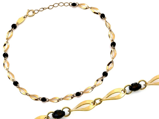 Złota bransoletka owalne ogniwa czarne kamienie
