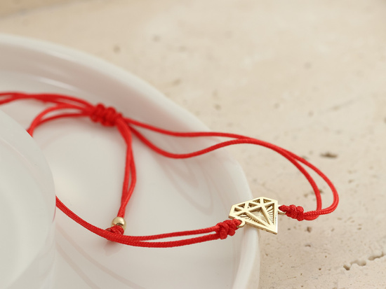 Bransoletka złota diament graficzny na czerwonym sznurku